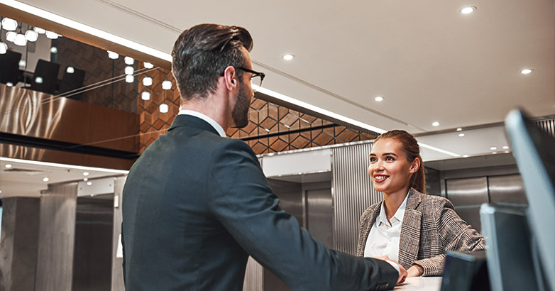 People at hotel discussing the last hospitality and tourism marketing trends