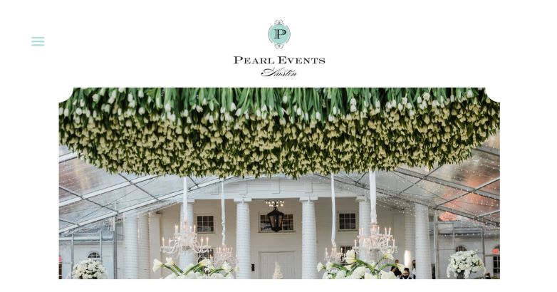 Pearl Events Austin’s website featuring hero image, showcasing an opulently decorated space beneath a canopy of delicate flowers, sets an immediate upscale tone with minimalistic layout.