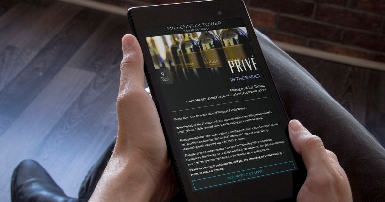 Individual showcasing a smartphone with an email related to travel content marketing and email marketing techniques.