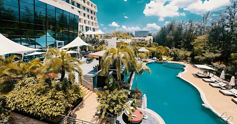 Aerial view of luxury outdoor pool in elegant hotel with eco-friendly and relaxing atmosphere