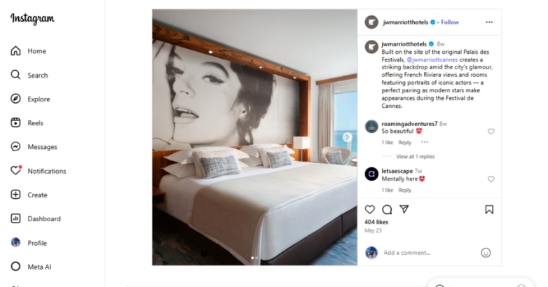 A hotel room featuring a bed and a wall adorned with a picture of a woman, ideal for social media promotion.