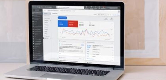 Google Analytics dashboard on a Mac, utilized by a digital marketing consultant for optimizing hotel advertising campaigns.