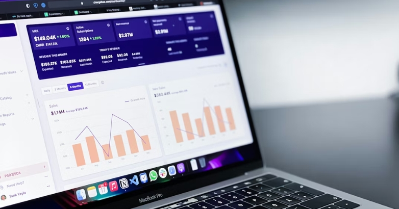 A laptop featuring a dashboard focused on hotel branding revenue and performance metrics.