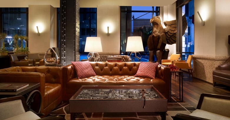 An upscale hotel lounge with refined décor represents how visual branding and atmosphere shape guest expectations during the pre-stay planning phase.