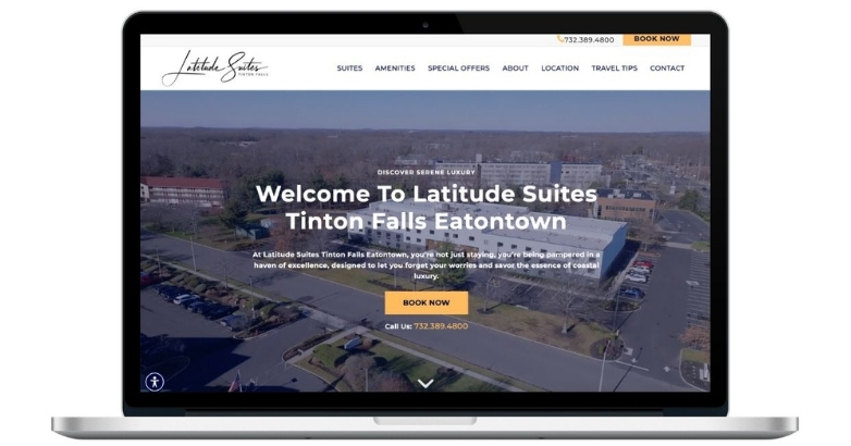 Latitude Suites hotel website on laptop with a prominent Book Now call to action