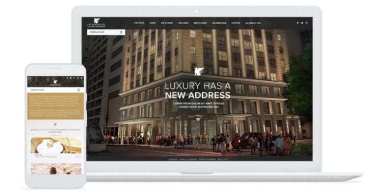 Smartphone and laptop displaying a luxury hotel website.