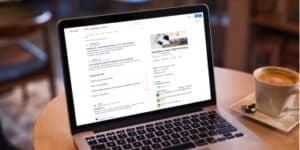 Hotel SEO content research using Google search results on a laptop