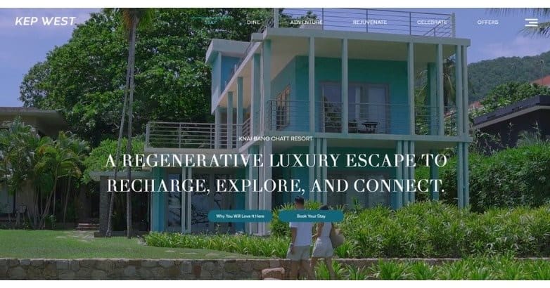 A modern, two-story resort building surrounded by lush greenery, promoting a luxury escape for relaxation and exploration.