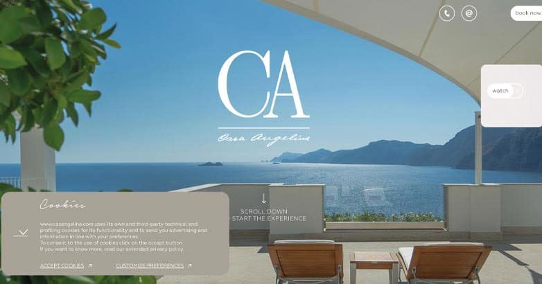 A scenic view of the ocean from a modern terrace, featuring lounge chairs and a logo for Casa Angelin.