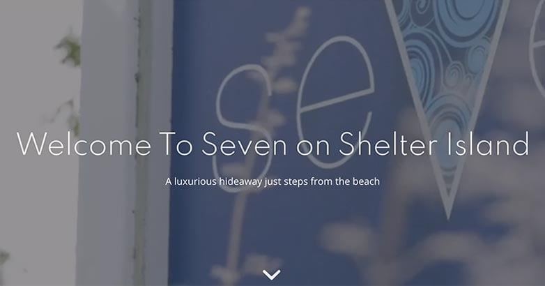 Text on a welcoming sign for "Seven on Shelter Island," describing it as a luxurious hideaway near the beach.