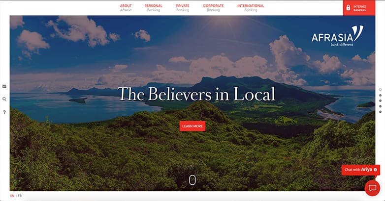 Afrasia Bank's website with a scenic landscape and emphasis on local banking services.