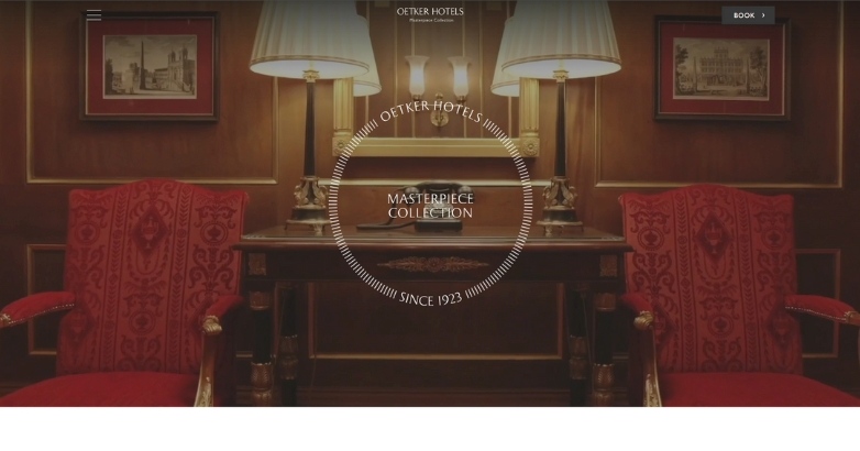 The Oetker Collection luxury hotel website features a red chair and a lamp, highlighting elegant interior design.