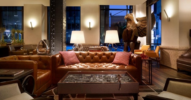 An upscale hotel lounge with refined décor represents how visual branding and atmosphere shape guest expectations during the pre-stay planning phase.